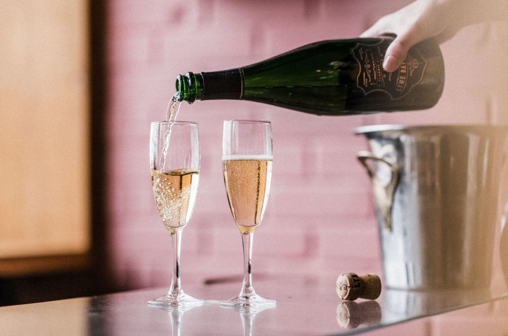 Lyme bay sparking wine poured into two flute glasses